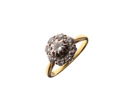 Yellow metal ring set diamond cluster, the shank stamped 18ct, size K, 3.4g approx gross   Condition: 