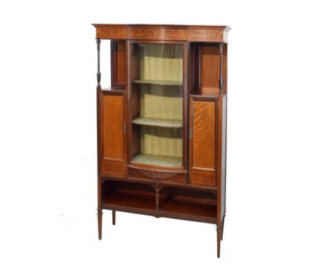 Edwardian inlaid mahogany display cabinet fitted three shelves enclosed by a bowed glass door, open shelf and slender cupboar