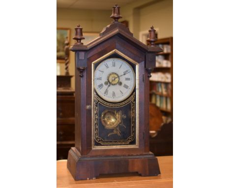 Late 19th/early 20th Century mahogany and beech cased mantel clock having an alarm movement, the off-white dial with Roman nu