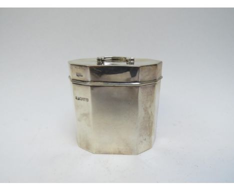 An Alfred Marston silver tea caddy, handle mounted to top, faceted body, Chester 1920, 8.2cm x 9cm x 5.5cm, 148g 
