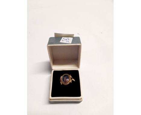 A gold ring set with an opal in rope twist mount, unmarked. Size L/M, 2.2g 