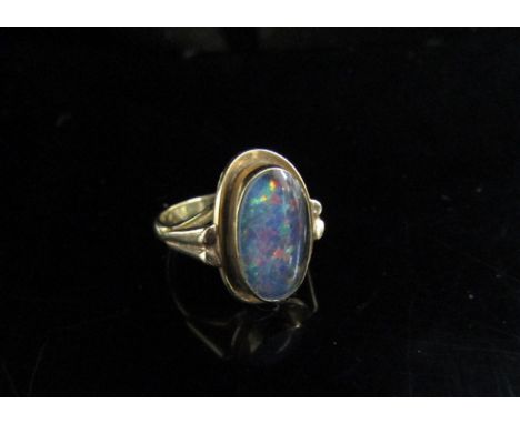 A 9ct gold ring set with an oval opal. Size K, 3.6g 