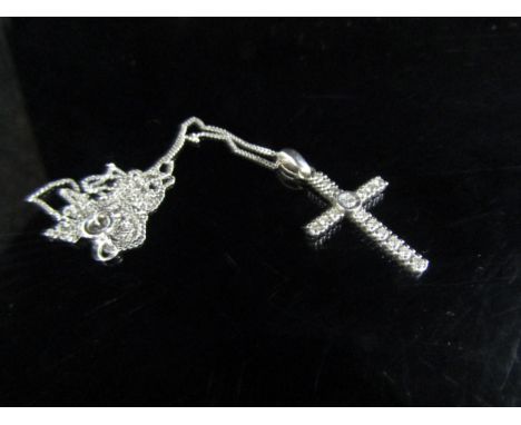 A 9ct white gold diamond set cross pendant hung on a white gold chain, stamped 375, 50cm long, 1.9g 