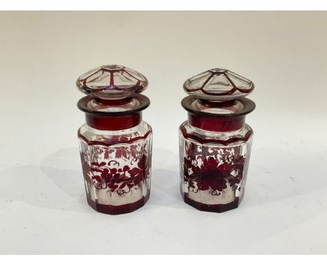A pair of Victorian ruby overlay lidded jars, 15.5cm tall 