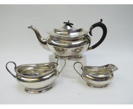 A Charles S Green &amp; Co., silver three piece tea set consisting of teapot, sucrier and milk jug, plain design, marks rubbe