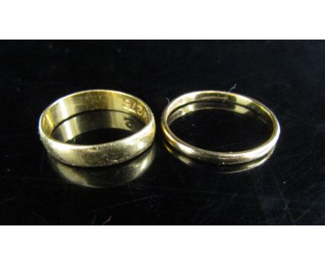 A 22ct gold wedding band. Size P and a 22ct gold wedding band. Size J/K, 4.9g 