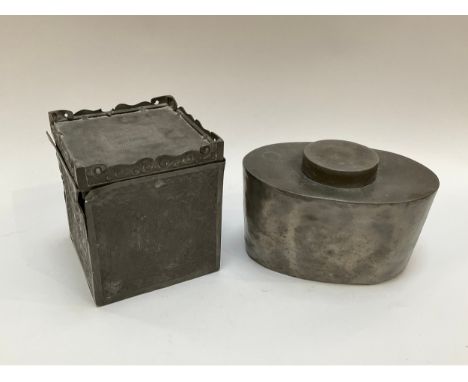 A 19th Century Oriental pewter tea caddy with compartmental container interior and an oval example (2) 