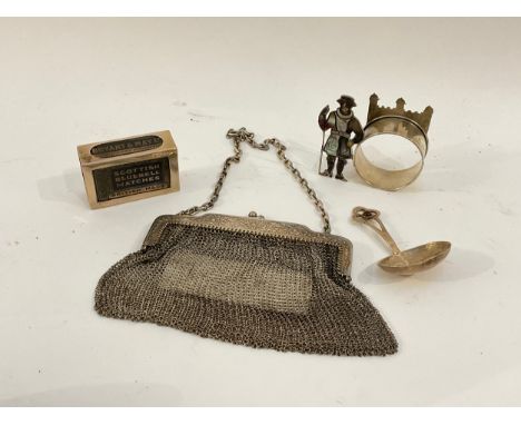 An early 20th Century silver purse, napkin ring of figural design, a matchbox holder and a caddy spoon (4) 