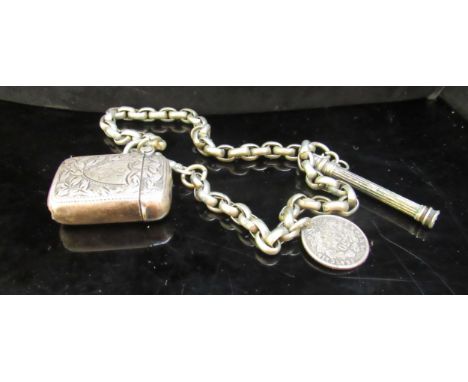 A small silver vesta hung on a watch chain with coin fob, 35g 