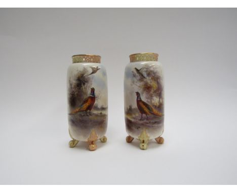 A pair of Royal Worcester vases painted by James Stinton with pheasants in the landscape, c.1911, 14cm tall 