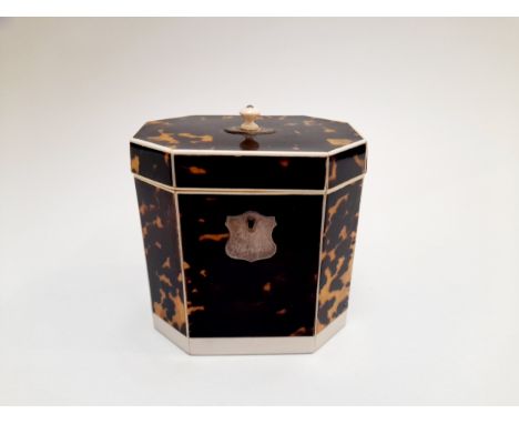 A Georgian tortoiseshell veneered tea caddy of canted rectangular form, with inner lid, ivory license submission reference 4T