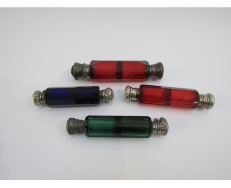 Four coloured glass double ended scent bottles including ruby, emerald and Bristol blue glass examples 