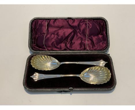 A pair of Harrison Brothers &amp; Howson (Henry Harrison) silver serving spoons, shell bowls with signs of gilding, Sheffield