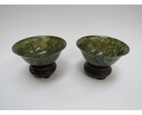 A pair of modern moss green jade style bowls on pedestal bases, 10cm diameter, 4.5cm tall 