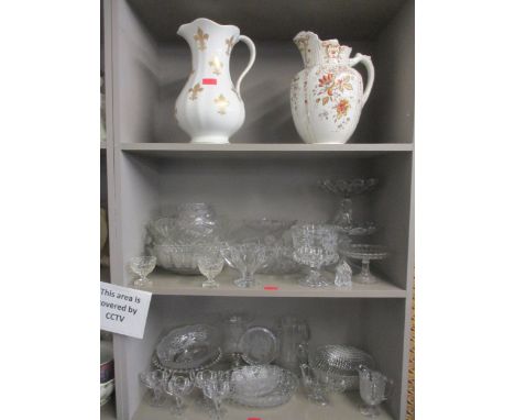 A quantity of late Victorian and later pressed and cut table glass to include Chippendale glass, an engraved celery vase, and