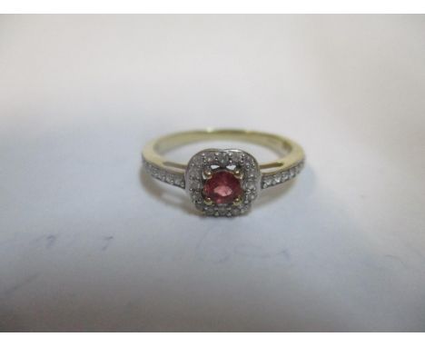 A gold coloured ring stamped 10k set with a ruby and diamond, 1.75gLocation: 