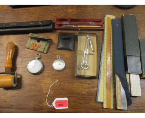 A mixed lot of drawing map implements to include a compass, and slide rules, along with an Air Ministry stop watch in silver 