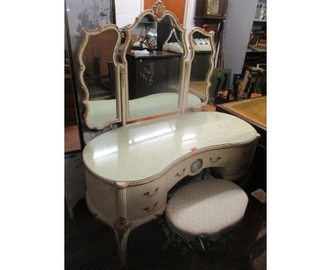 A vintage French style dressing table having a trifold mirror, five drawers and on cabriole legs, 154cm h x 124cm w, together