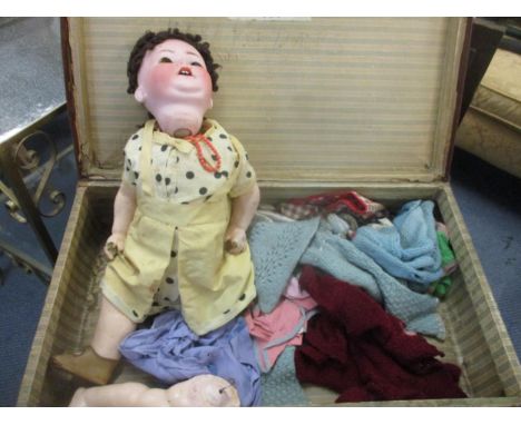 A Heubach Kopplesdorf bisque headed doll, eyes deficient, open mouth with moving tongue, jointed composition body (needs rest