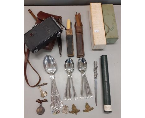 A mixed lot to include silver plated flatware, cut throat razors, a vintage Zeiss camera in leather case, a Berlin 1936 ename