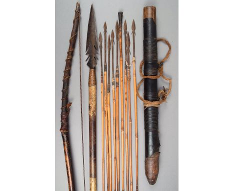 A bushman's spear with an iron blade and with copper bound and vellum covered shaft, 68cm long, a wood and sinew bow and eigh