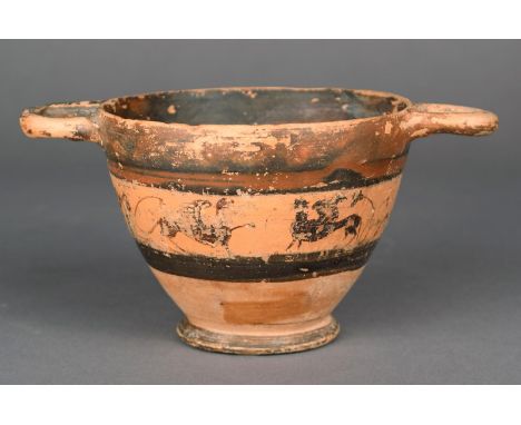 A Greek skyphos raised on a spreading foot, the body painted a band of griffins and sphinx, the rim with a pair of open handl