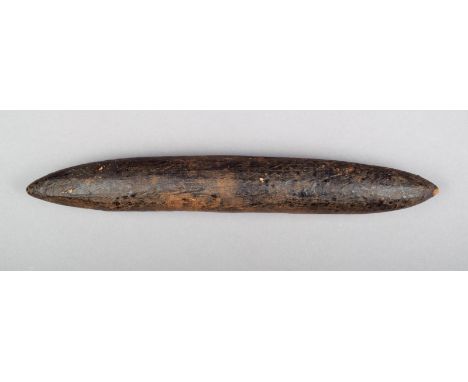 An Aborigine message stick Western Australia wood, with a resin finish and circular nodules, 23cm long. Provenance By repute 