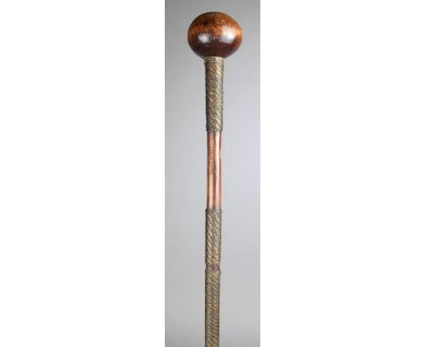 A Zulu knobkerrie South Africa wood, with wirework bands, having a spherical finial, the shaft with incised notches, 77cm lon