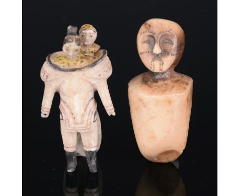 λ An Inuit amulet bust Alaska carved walrus tusk, with a head having crescent eyes and mouth with incised tattoos, 5cm high, 