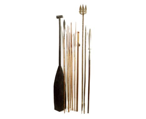 An Oceanic ebonised paddle wood, with bands to handle, 148cm long, a Chinese faceted staff with a bell, a spear with a leaf s