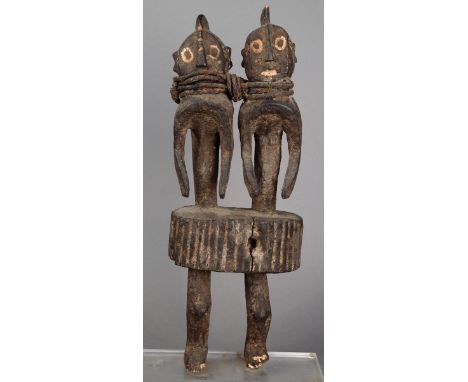 A Mumuye double figure Nigeria wood, with two torsos having central crestings and linked with oiled fabric tie, from a ribbed