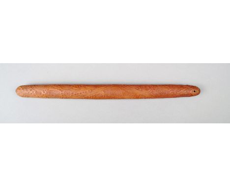 An Aborigine message stick Western Australia wood, with engraved concentric circles, lines and dots, with remains of red ochr