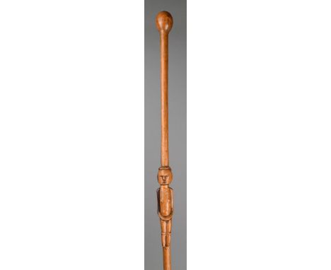 A Zulu / Tsonga staff South Africa two tone wood, with a carved central figure and with a spherical finial, 87.5cm long.