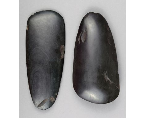 Two Melanesian green stone axe heads 19th century, 15cm and 16cm long. (2)