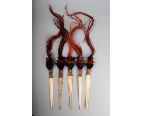 Five Naga hair ornaments North East India the tapering bone blades with incised geometric decoration with dyed hair mounts, 4
