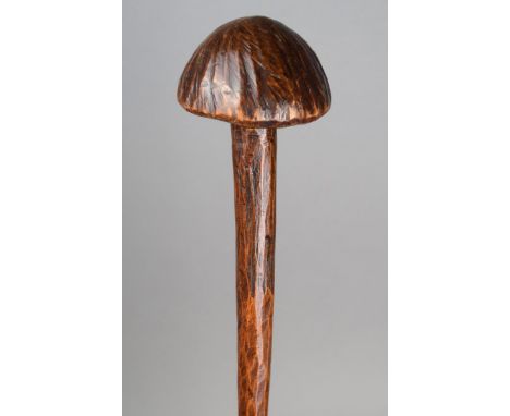 A Polynesian throwing club wood, with an adzed finish and a mushroom head finial, 61.5cm long. Provenance Elijah Armitage 178