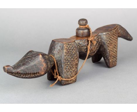A Kuba zoomorphic divination implement Democratic Republic of Congo wood, with chevron carved sides, with a smooth top and wi