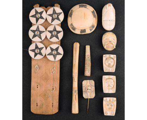 λ A set of six Inuit buttons marine ivory, circular with an incised five pointed star, mounted on a pine board, 2.8cm diamter