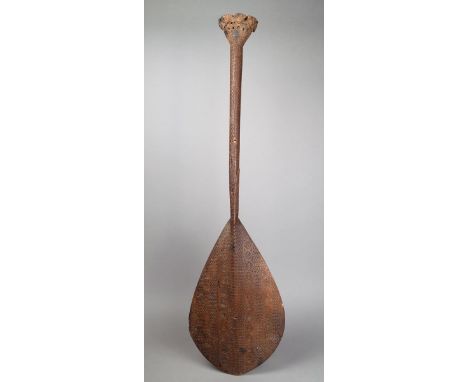 An Austral Islands dance paddle Polynesia carved wood, with suns, 'X's', crescents and chevrons, with eight dancing girls to 