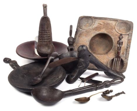 An Ifugao ladle Philippines carved wood, with a seated figure and pierced crest, 29cm high, two circular wood bowls, one with