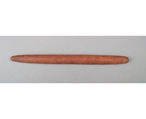 An Aborigine message stick Western Australia wood, with engraved concentric circles, lines and dots, with red ochre, one end 