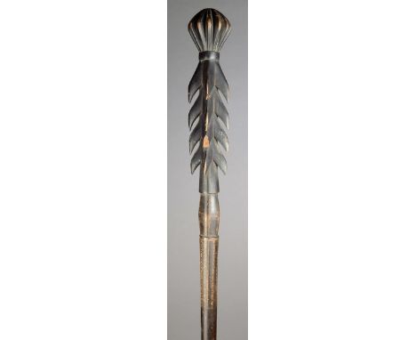 A Solomon Islands staff Melanesia wood, with a lemon squeezer finial and four rows of barbs above incised geometric decoratio
