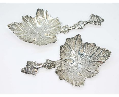 A pair of cast silver caddy spoons formed as vine leaves, Joseph Willmore, Birmingham 1840, wt. 1.49ozt.  Condition - one has