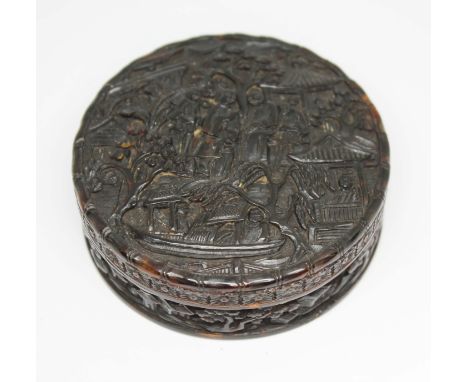 A Chinese Canton tortoiseshell snuff box, 19th century, of circular form, the top finely decorated with figures, trees, pagod