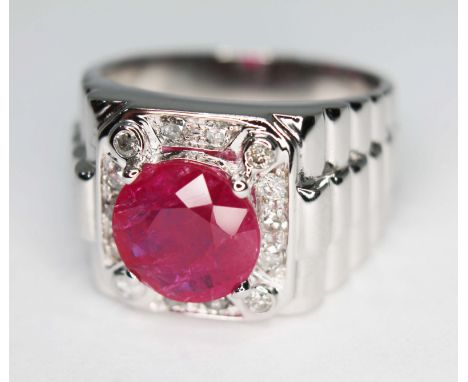 A ruby and diamond Rolex design signet ring, the central round stone weighing approx. 1.68 carats, measuring approx. 8.73mm x