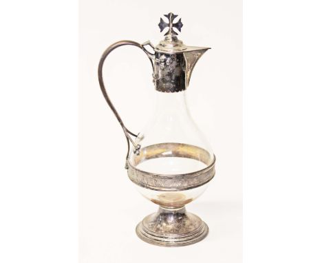 A late Victorian silver mounted glass ecclesiastical jug, hinged cover with cross finial, silver spout, shaped handled with t