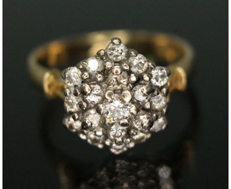 A diamond cluster ring, the hexagonal cluster measuring approx. 10.98mm x 13.09mm, hallmarked 18ct gold band, sponsor's mark 