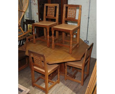 Robert 'Mouseman' Thompson of Kilburn adzed oak dining table and six chairs, the table having an octagonal top, the chairs ha