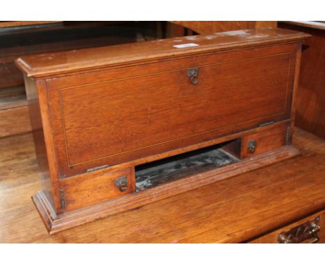 A late Victorian inlaid oak desk tidy with letter rack and ceramic ink wells, Arts &amp; Crafts style handles, height 24.5cm,