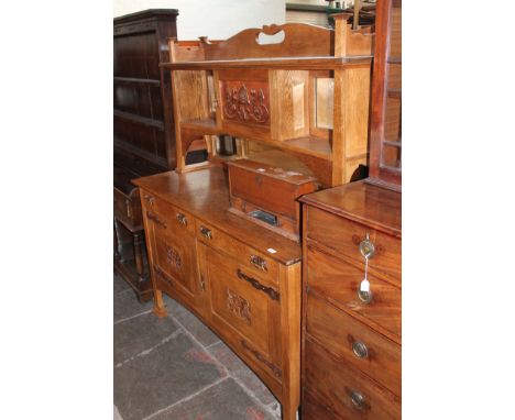 An Arts & Crafts light oak dresser with copper panel and strap hinges, width 153cm, depth 57cm & height 182cm.Some old woodwo